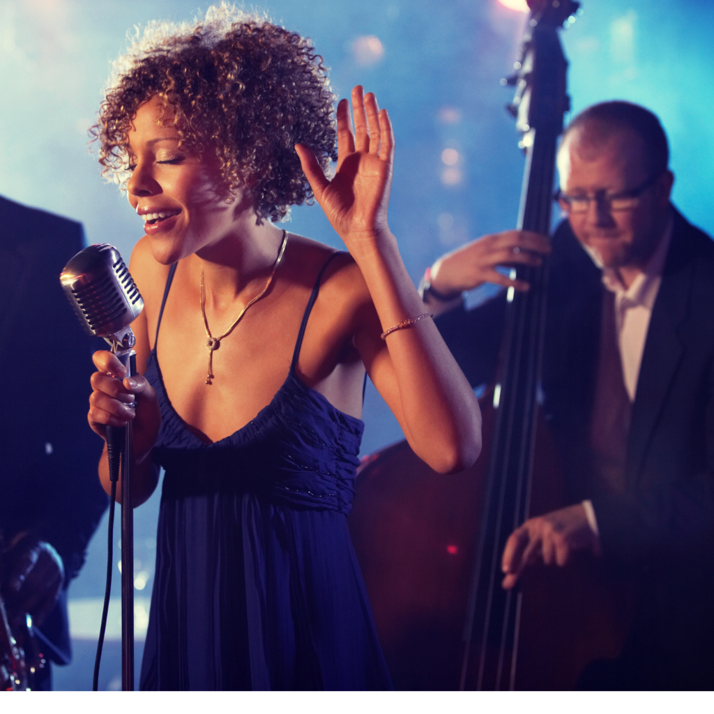 Live band performing at an event with happy guests.