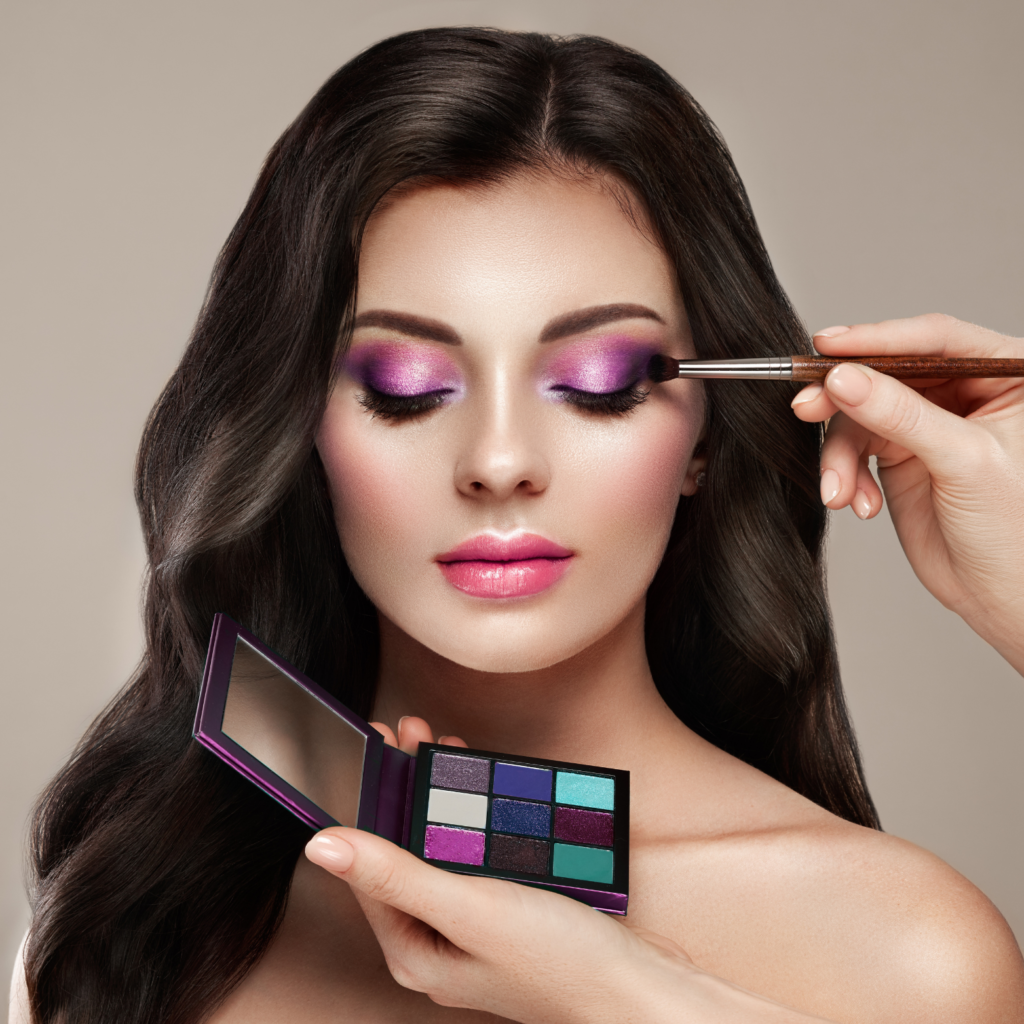 Makeup artist applying bridal makeup.