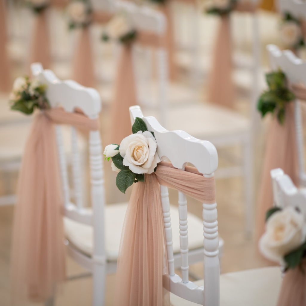Rows of tables, chairs, and tents set up outdoors.